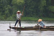 Removing mud at Perfume River