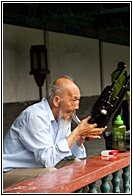 Chinese Man Playing Sheng