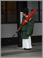Priest with Parasol